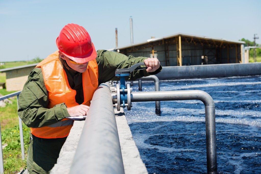 man working in water treatment facility