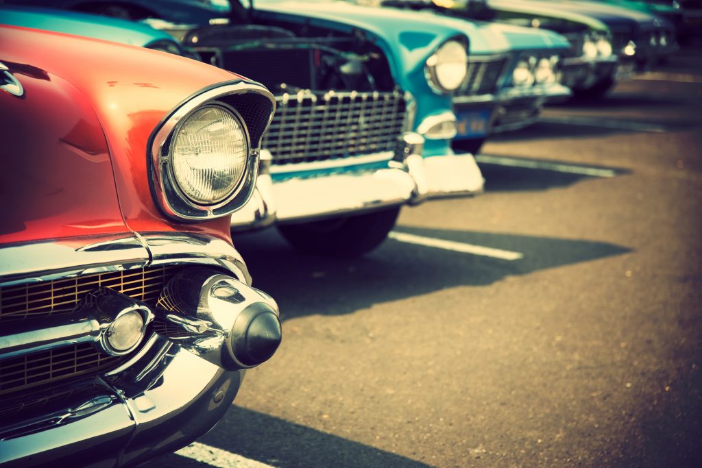 Old classic cars in a parking lot