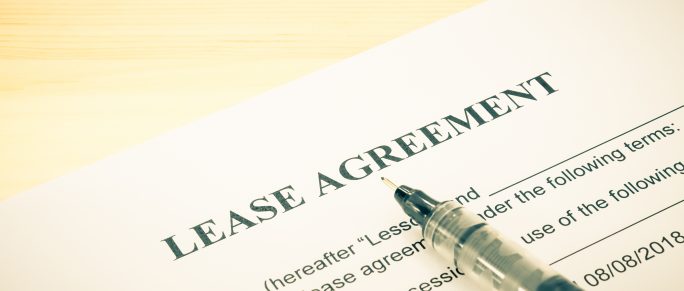 Lease agreement contract sheet and brown pen