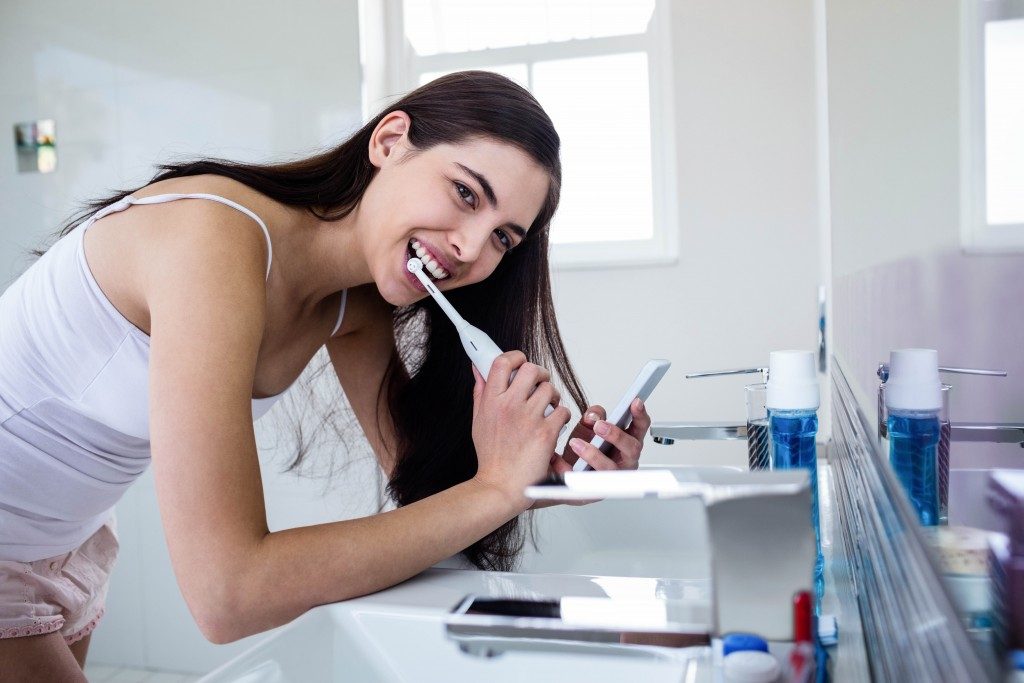 Woman brushing her teeth