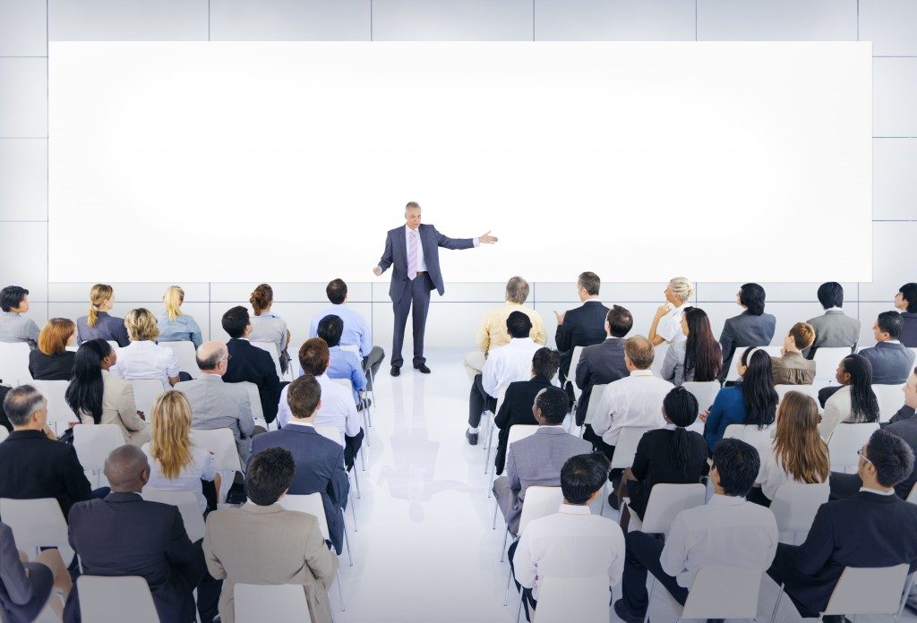 An audience listening to a Speaker