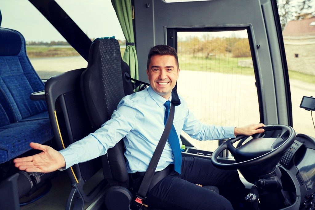 Bus driver welcoming passengers