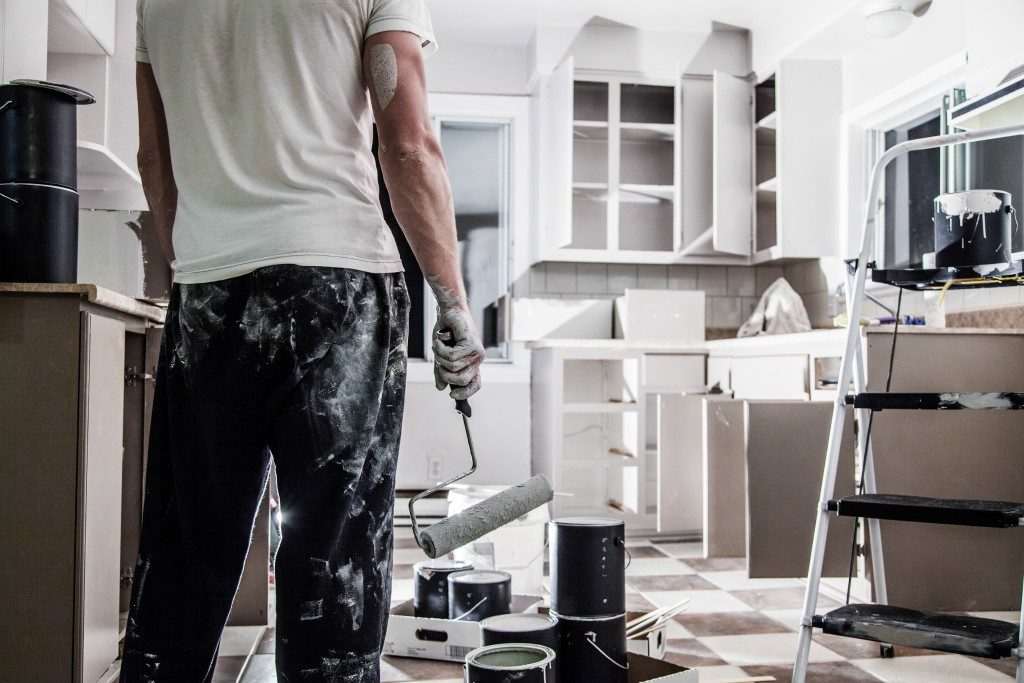 Man Renovating a House