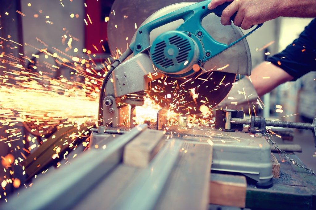 Man cutting metal