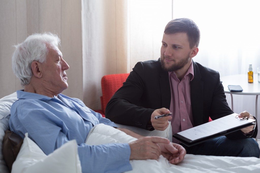 old businessman talking to his lawyer