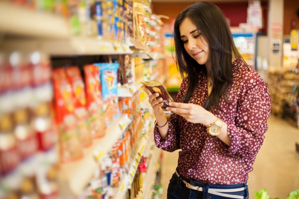 a woman shopping at a grocery store