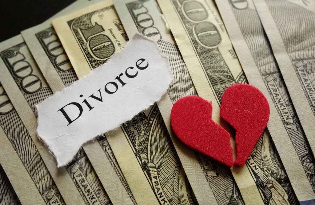 divorce concept with money and a broken heart