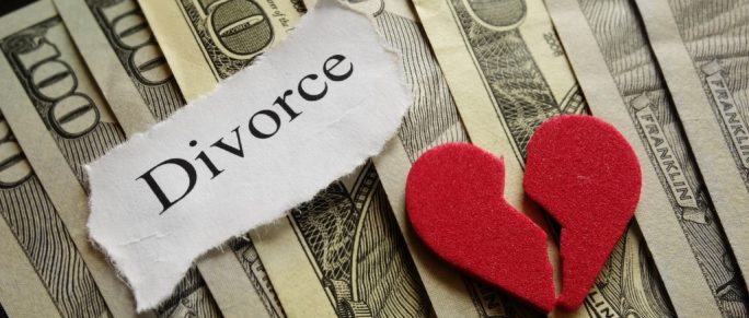divorce concept with money and a broken heart