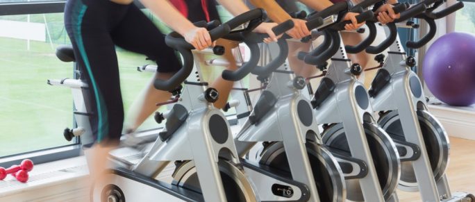 Fitness enthusiasts in a spin class