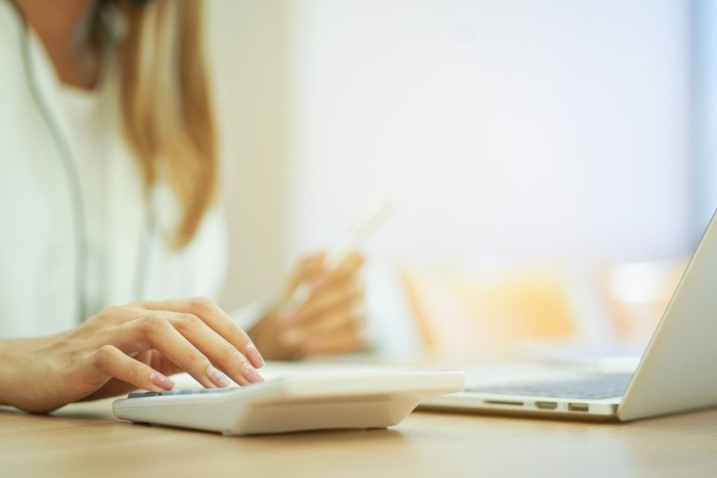 Woman using a calculator