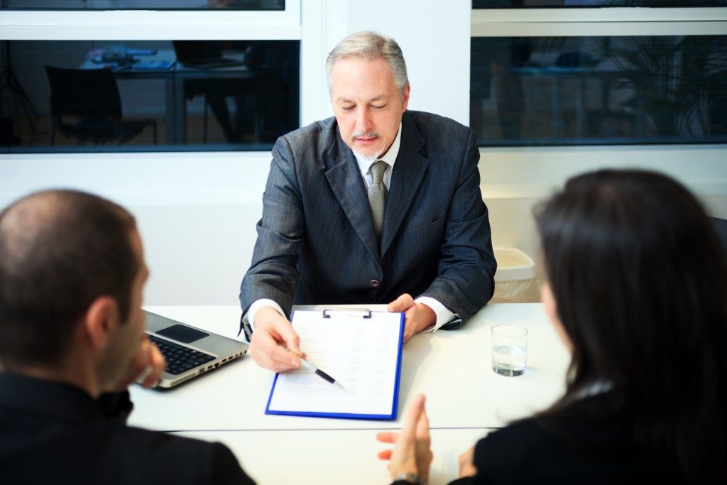 businessman showing a document