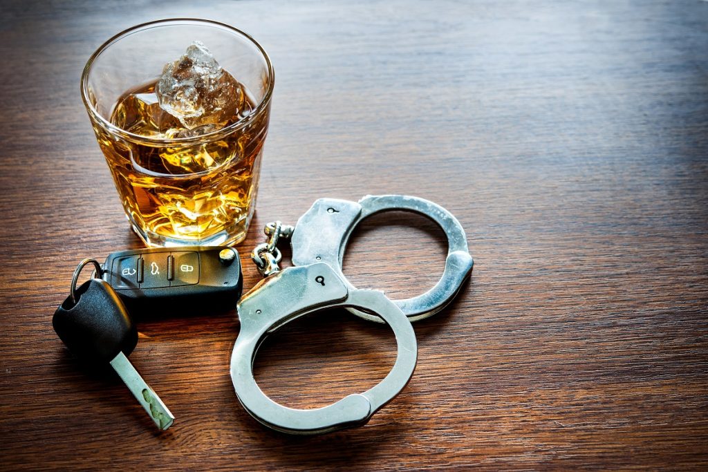 Alcoholic drink and car key DUI concepts