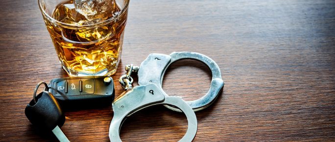Alcoholic drink and car key DUI concepts