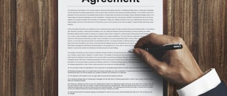 a man signing a divorce agreement